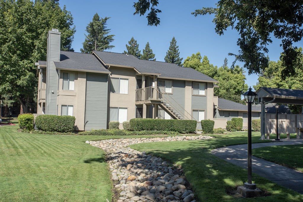 building exteriors and mail station at Delta Pointe Apartments, CA 95833