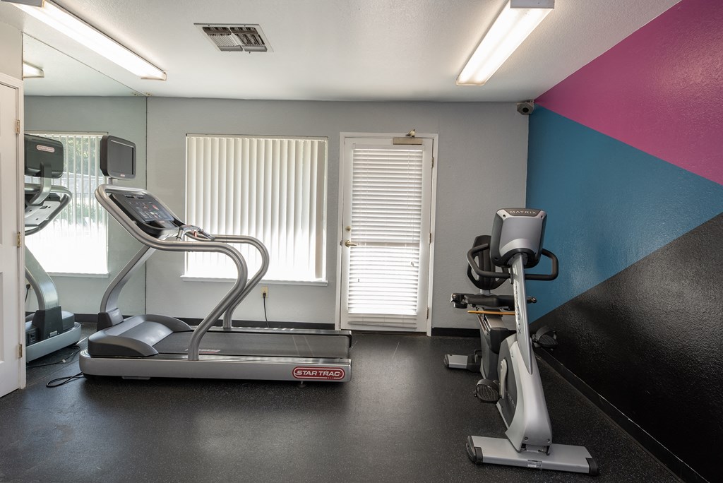 fitness center cardio equipment at Delta Pointe Apartments, Sacramento