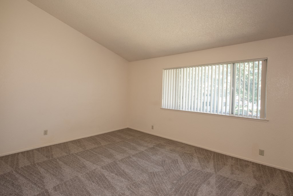 vacant primary bedroom at Delta Pointe Apartments, California