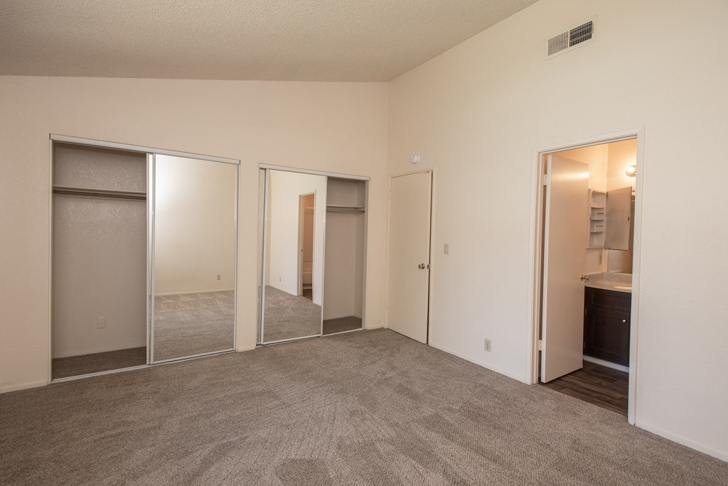 vacant primary bedroom and bathroom at Delta Pointe Apartments, California