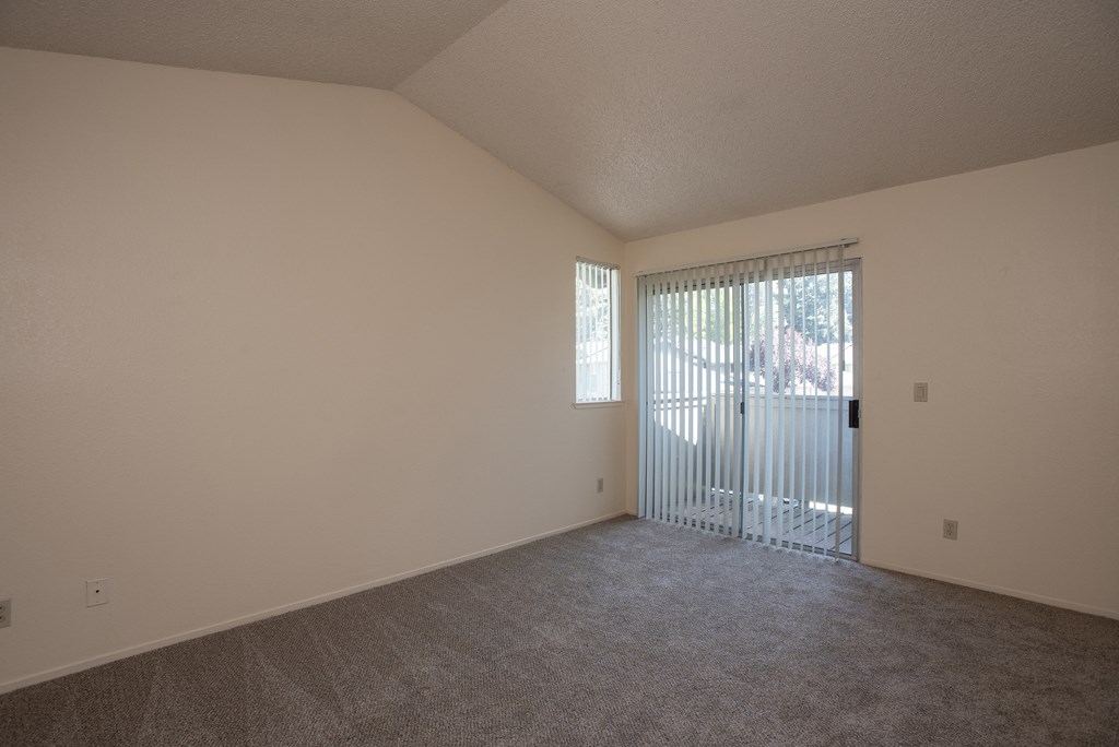 vacant primary bedroom deck at Delta Pointe Apartments, Sacramento, CA