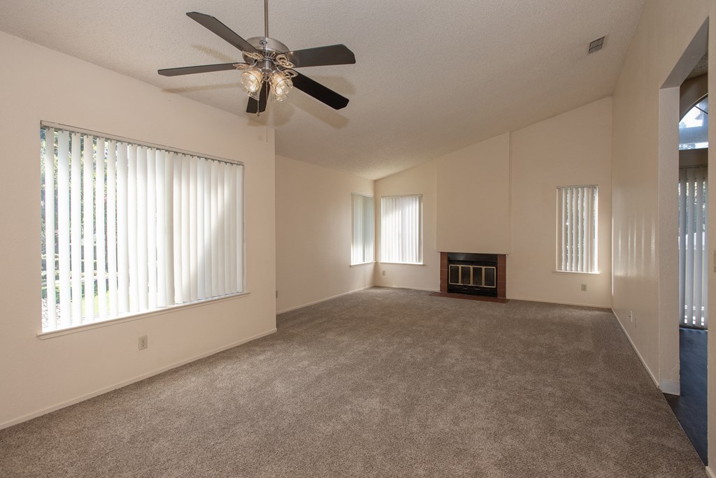 vacant living room fireplace at Delta Pointe Apartments, Sacramento