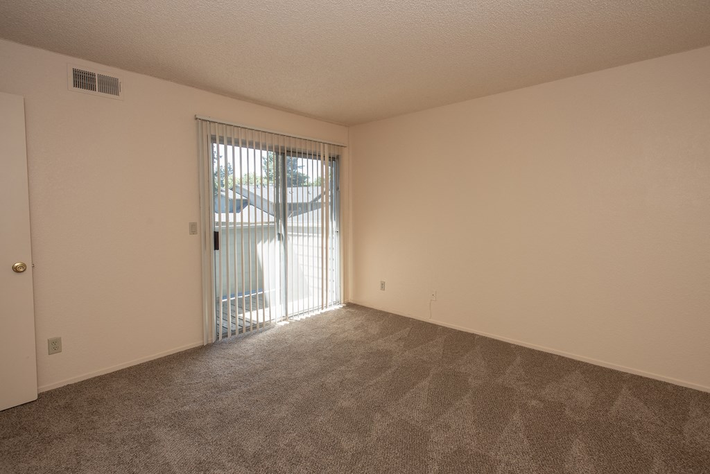 vacant primary bedroom deck at Delta Pointe Apartments, Sacramento
