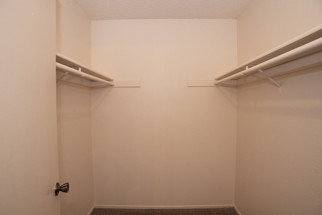 vacant primary bedroom walk in closet at Delta Pointe Apartments, Sacramento, CA