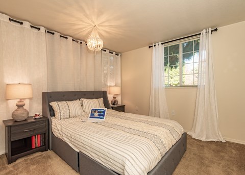 Hathaway Court model primary bedroom at Hathaway Court Apartments, Wilsonville, Oregon 97070