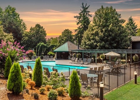 Seasonal pool exterior fence at sunset at King's Court Apartments, Beaverton, 97006