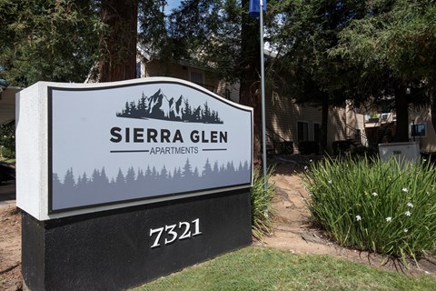 A sign for Sierra Glen Apartments is displayed in front of a building at Sierra Glen Apartments, California, 95621