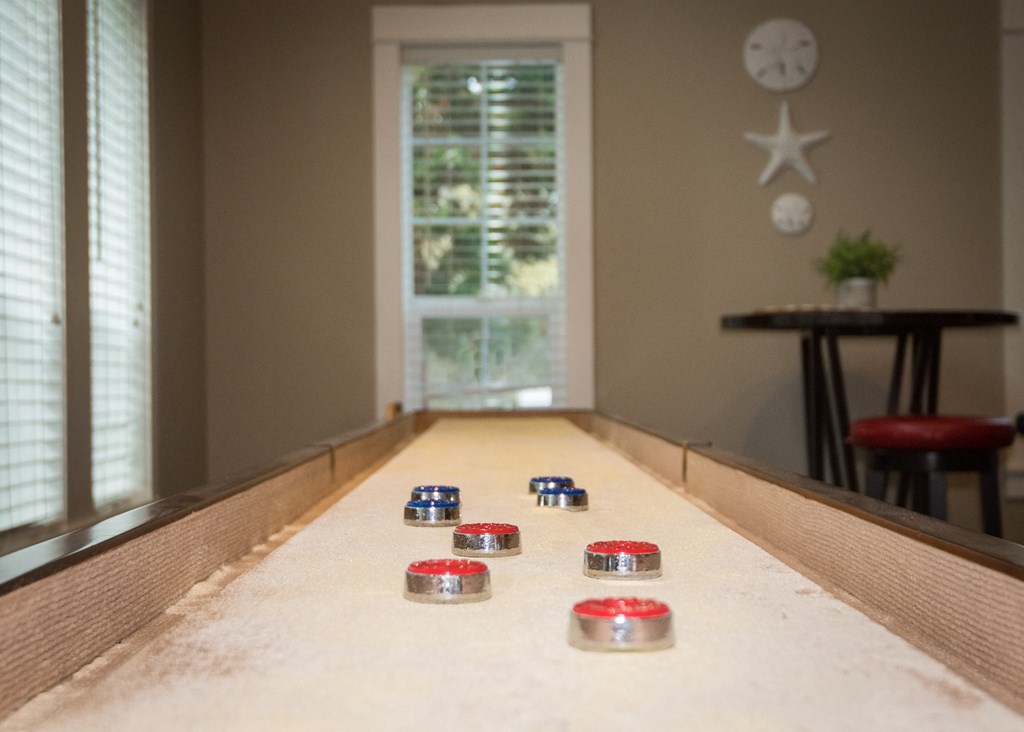 Stillwater clubhouse interior shuffleboard amenity