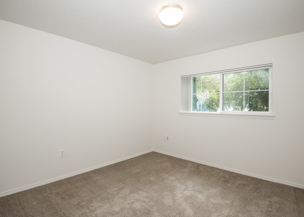 Stillwater vacant primary bedroom and window