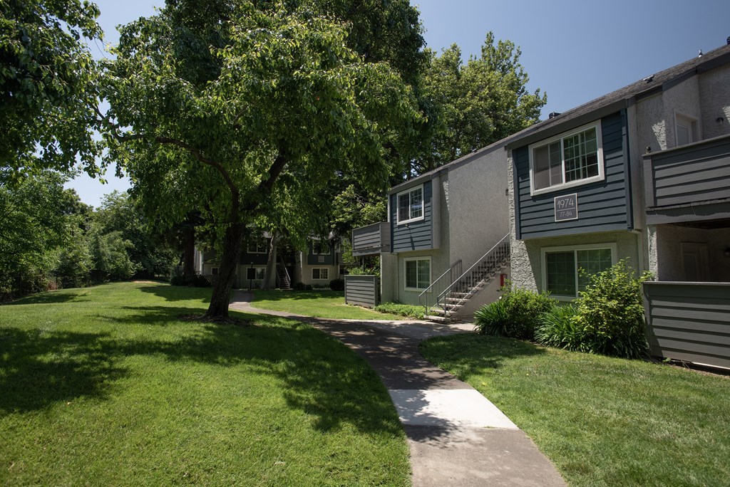 Woodbridge building exterior and green space at Woodbridge Apartments, California