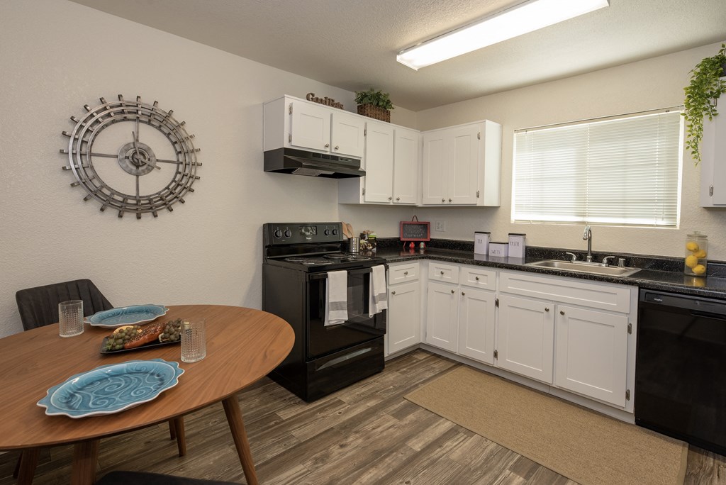 model kitchen and dining room at Woodbridge Apartments, California