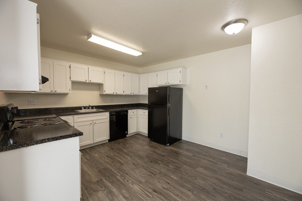 vacant 2x2 kitchen side view at Woodbridge Apartments, California
