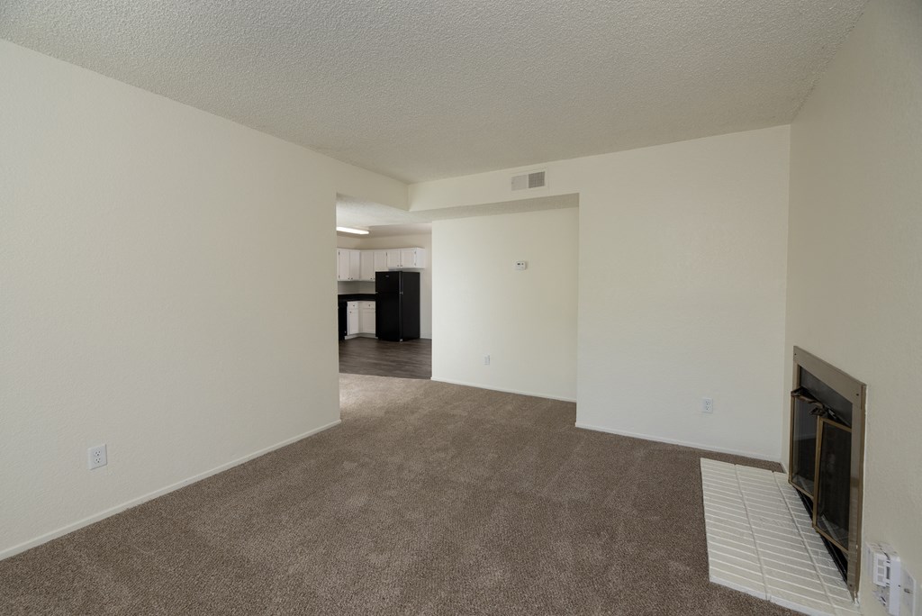 vacant 2x2 living room and kitchen view at Woodbridge Apartments, Sacramento, CA
