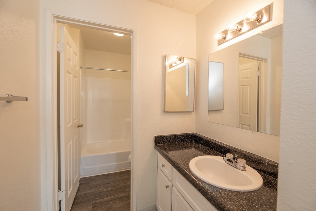 vacant 2x2 primary bathroom at Woodbridge Apartments, Sacramento, California 95833