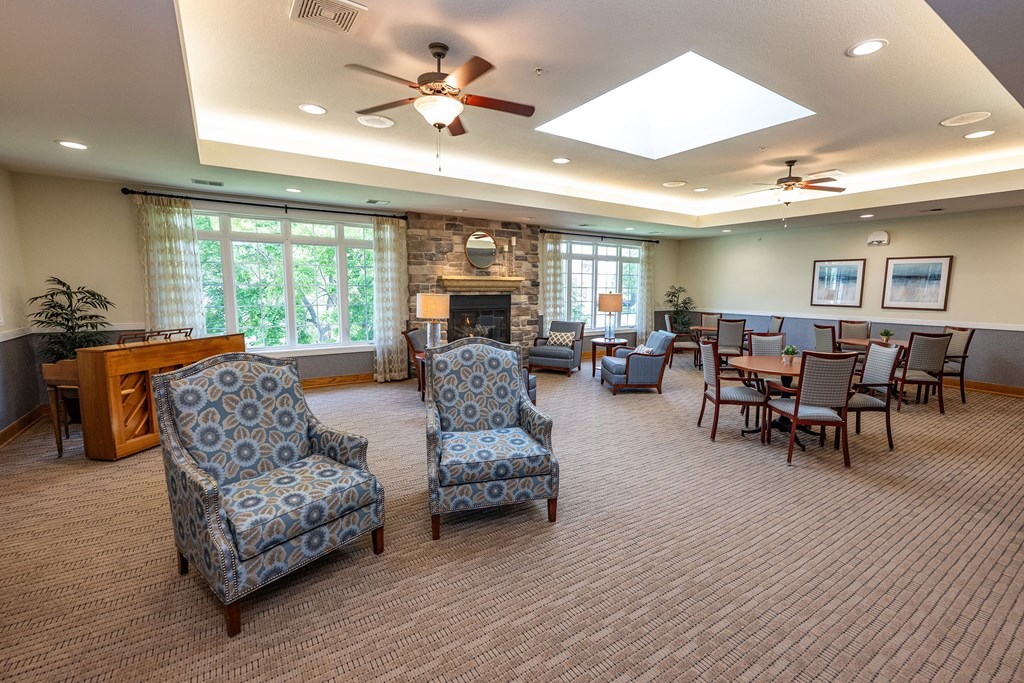 A living room with a fireplace and a piano.