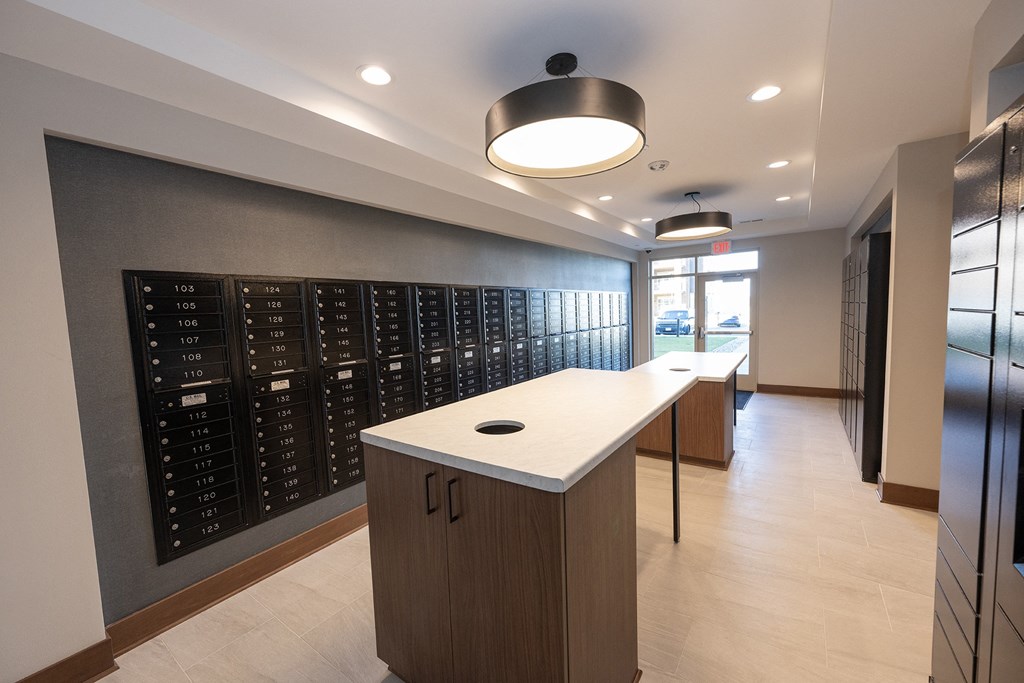 a tasting room with a white counter top and a large wine rack