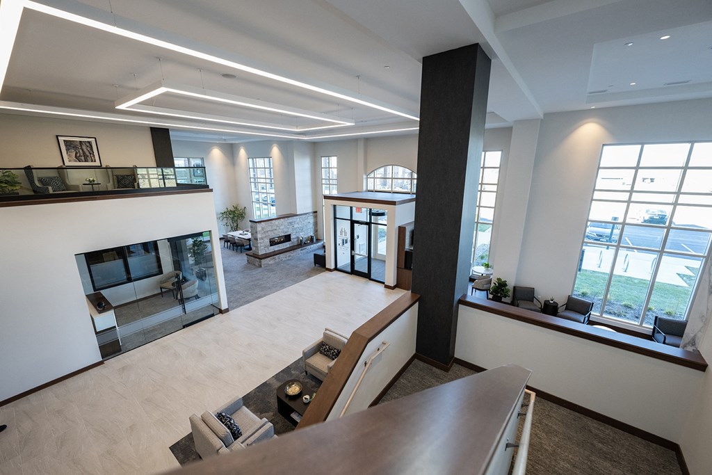 a view of a large living room with a fireplace and a table