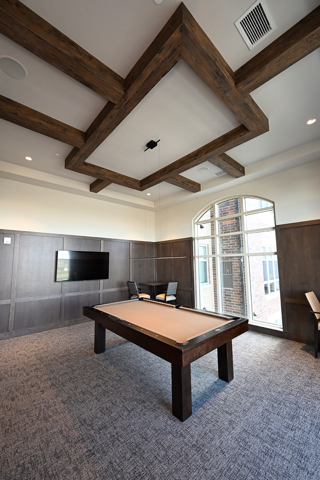 a conference room with a ping pong table and a tv