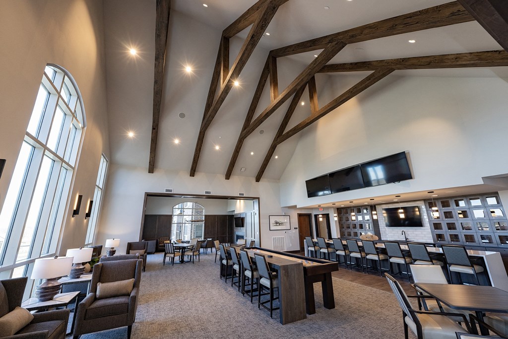 a large dining room with tables and chairs and a fireplace