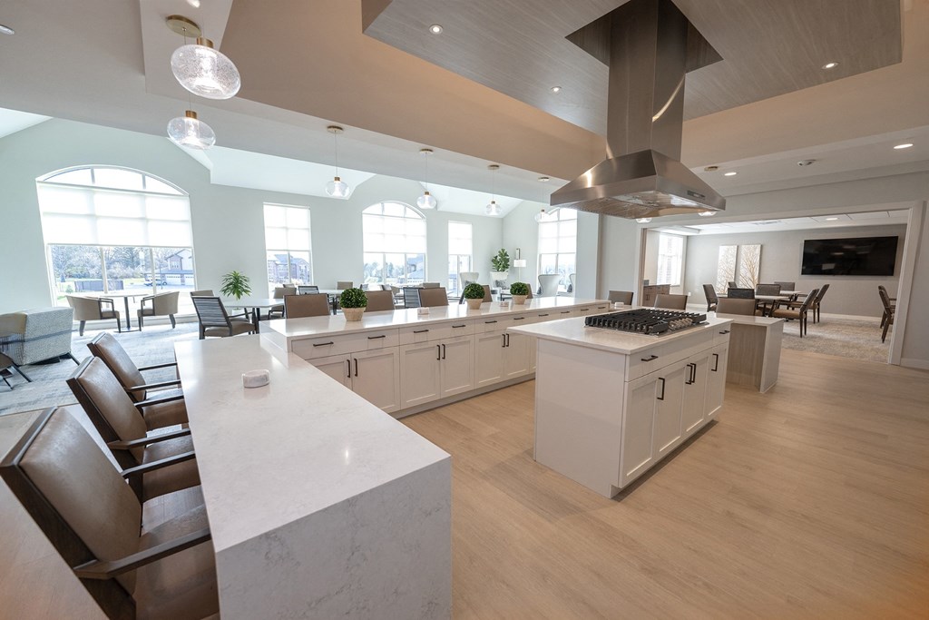 a large kitchen with a dining room and a living room