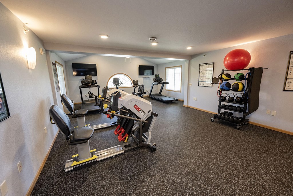 a room filled with furniture and a large window