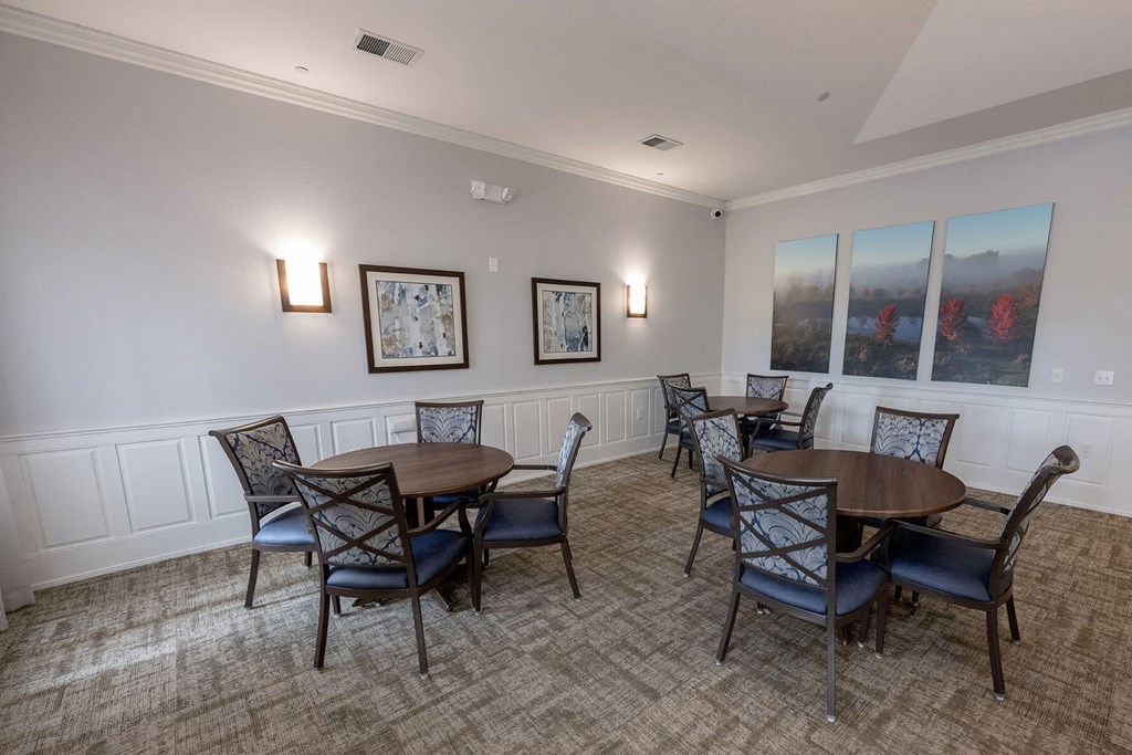 a dining room with tables and chairs