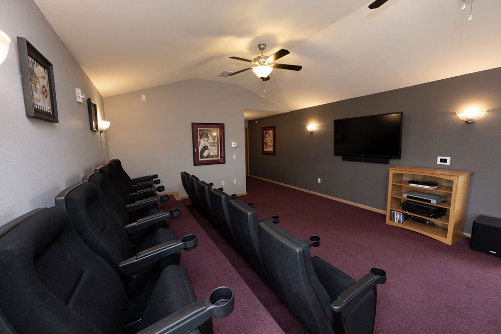 a room filled with furniture and a flat screen tv