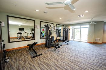a home gym with a large mirror and exercise equipment