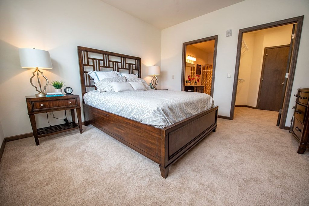 a bedroom with a bed and a closet