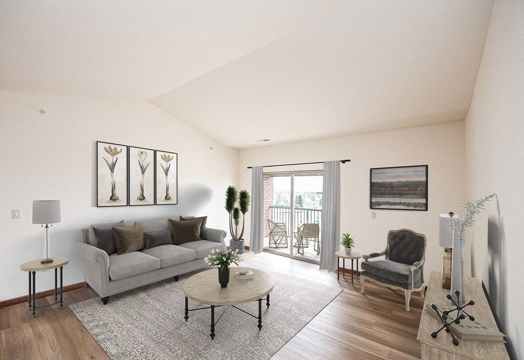 a living room with white walls and a sliding glass door leading to a balcony
