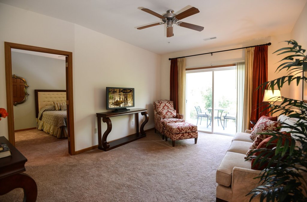 Large Living Rooms With Oversized Windows at Highlands at Riverwalk Apartments 55+, Wisconsin 53092