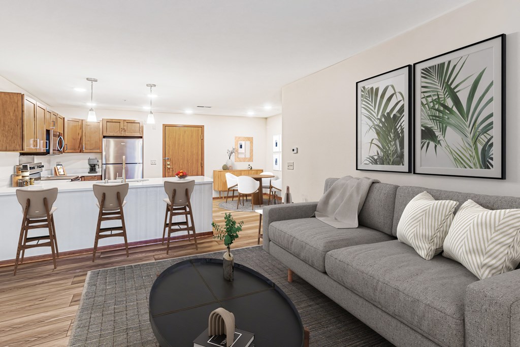 A living room with a grey couch and a black coffee table.