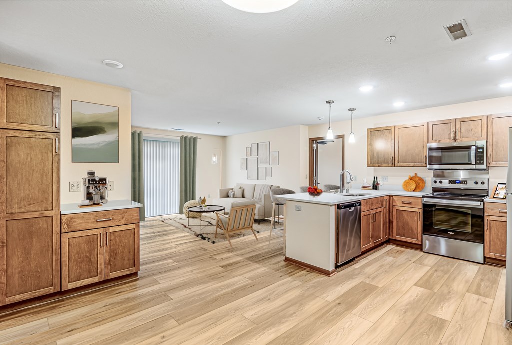 A kitchen with wooden cabinets and a white countertop.
