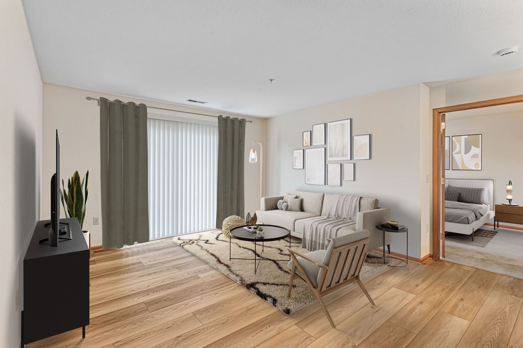 A living room with a brown chair and a black speaker.
