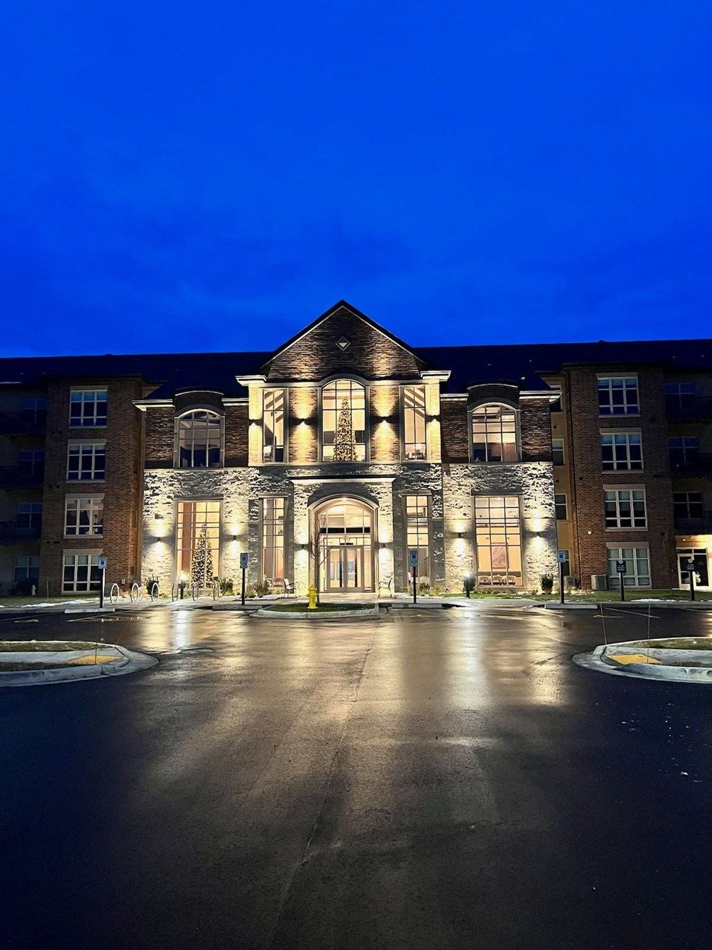 the building where the hotel is located is lit up at night