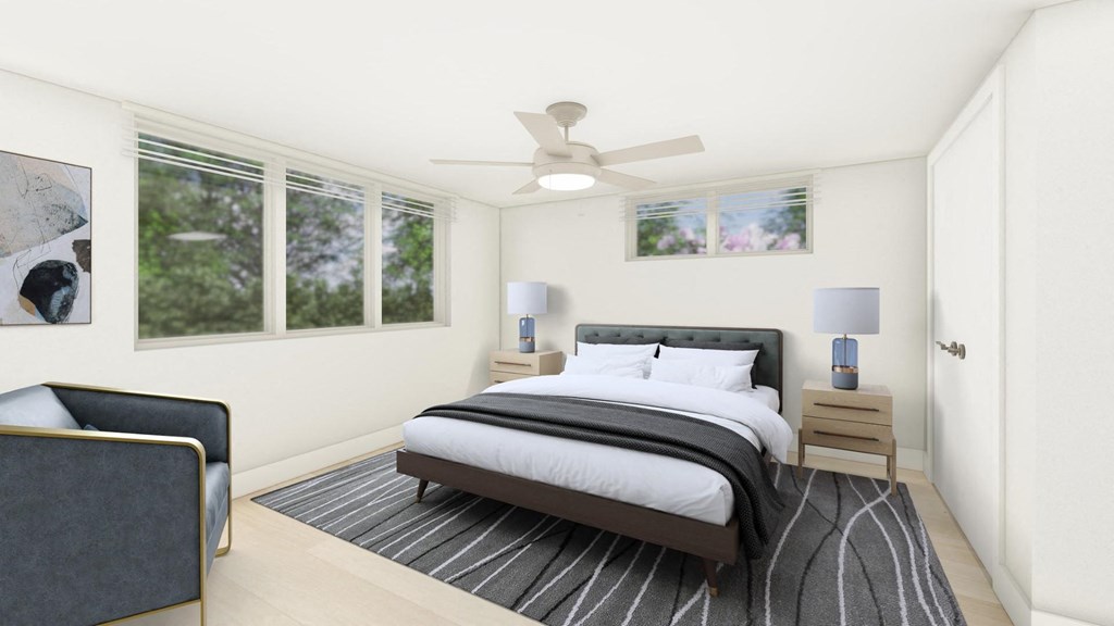 a bedroom with a bed and a ceiling fan