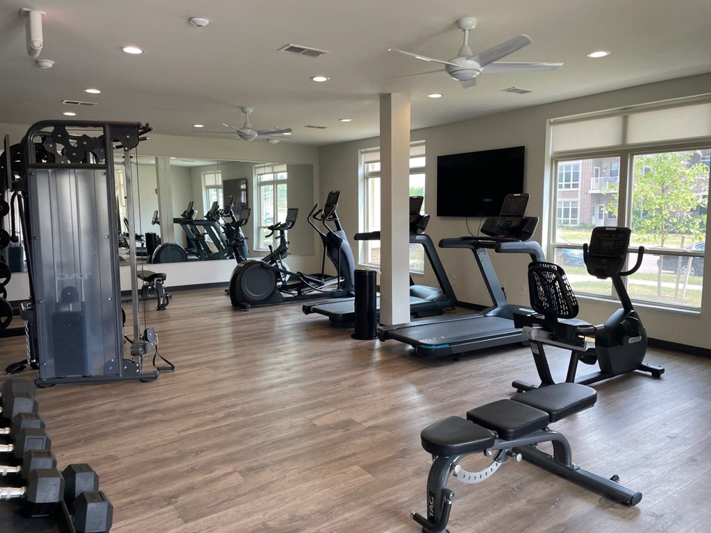 a fitness center with treadmills and other exercise equipment