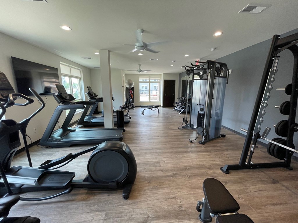 a room filled with lots of different types of exercise equipment