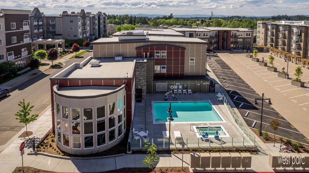 west parc apartments near portland and beaverton. Birdeye view of apartment property with a pool and hot tub.
