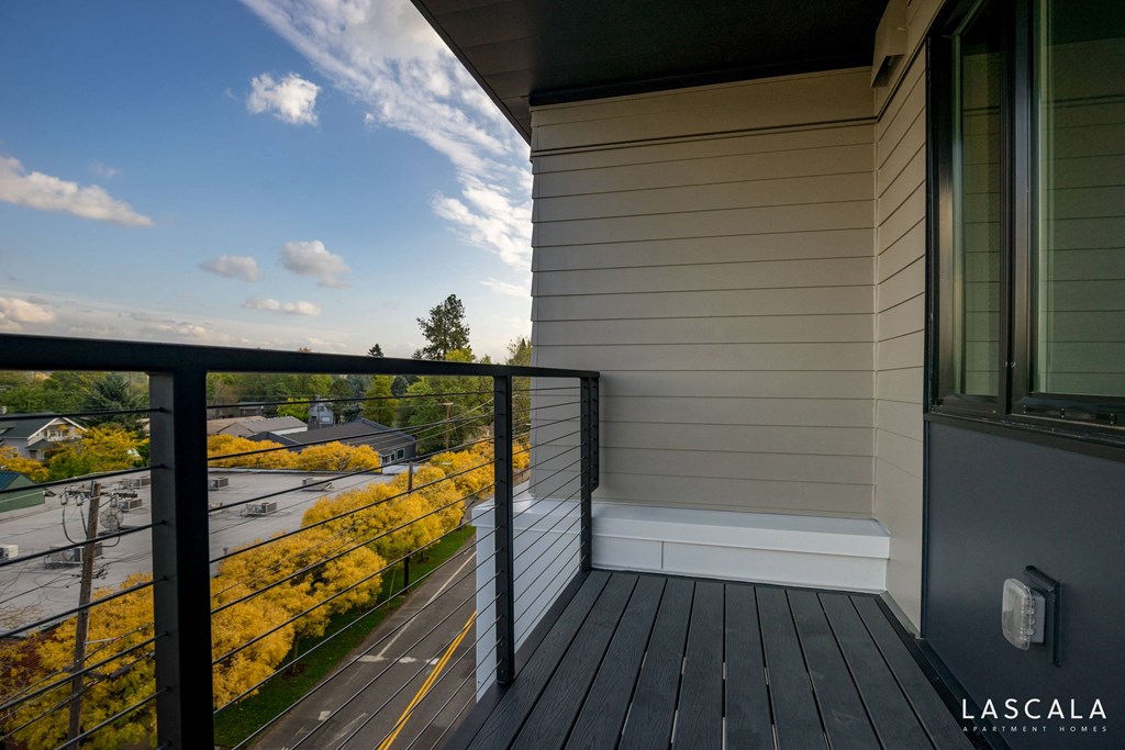 Spacious balcony with a view of Portland at LaScala Apartments in Beaverton, Oregon
