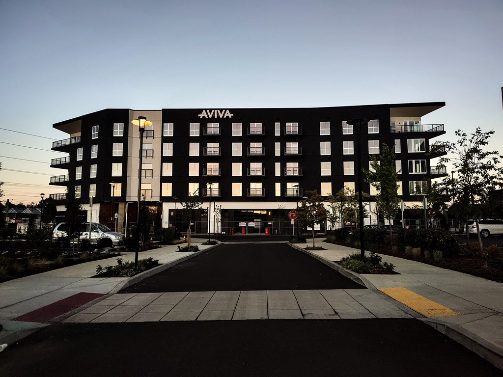 Parking lot view of AVIVA Apartments in Gresham Oregon