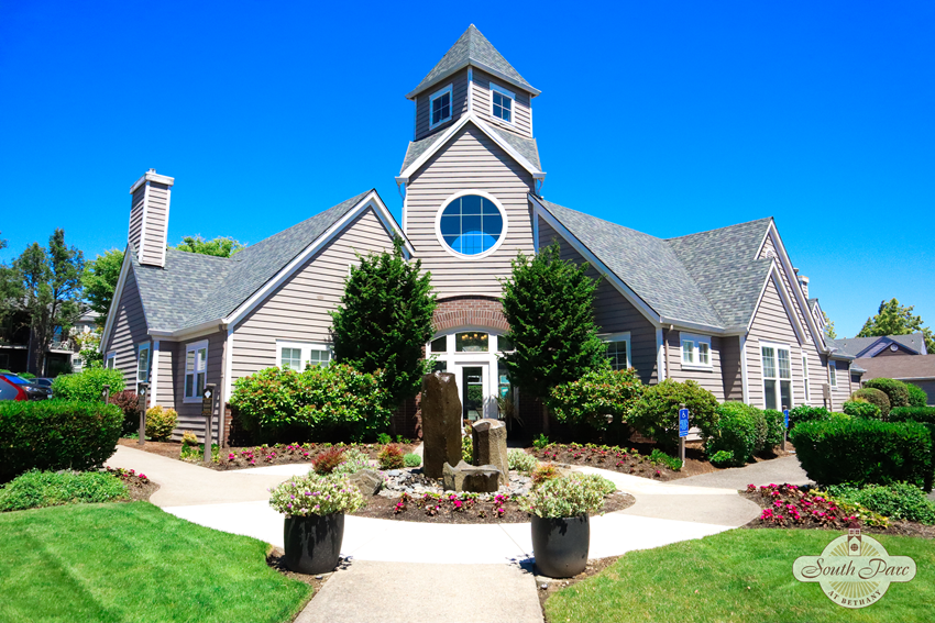 the front yard of a house with a garden and a church - Photo Gallery