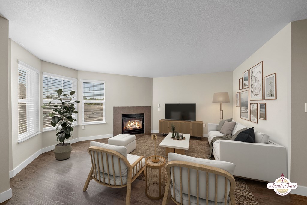 A living room with a fireplace and a couch.