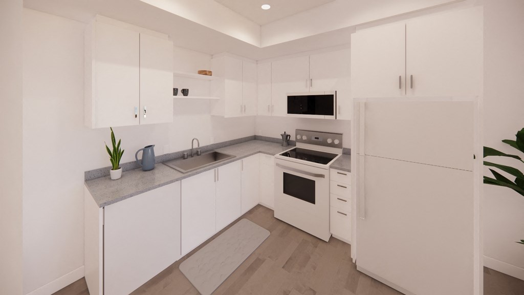 a white kitchen with white appliances and white cabinets