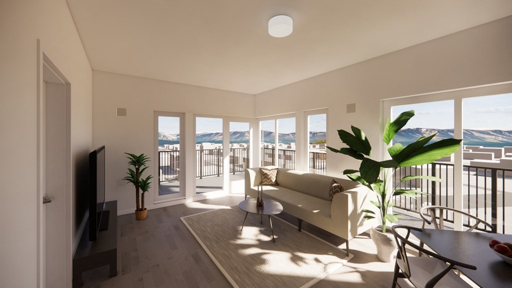 a living room with a couch and a table and a balcony