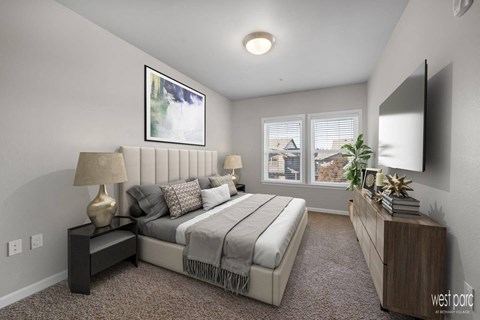 a bedroom with a bed and a large window