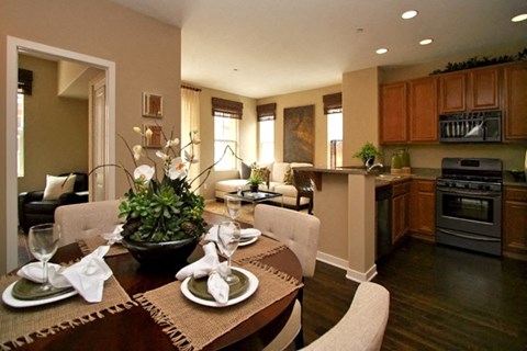 a kitchen and dining room with a table and chairs