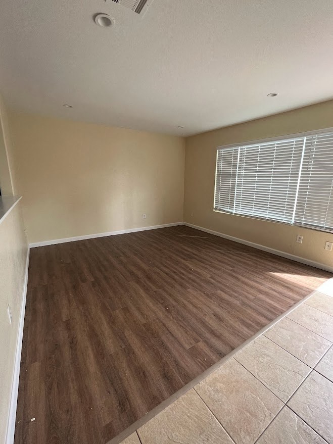 Living room with a large window at 980 E Mission Avenue Apartments.