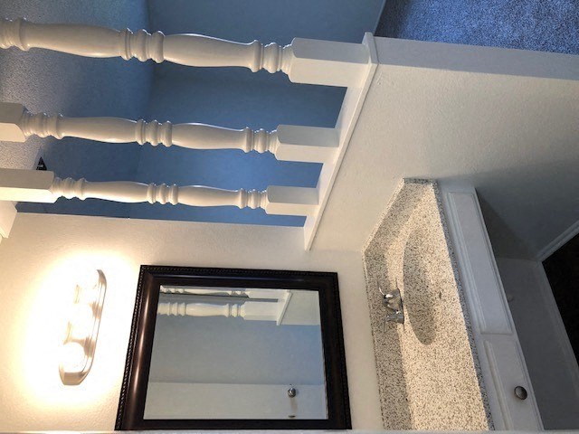 a bathroom with a shower and a mirror