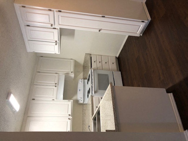 Las Casitas kitchen with white cabinets